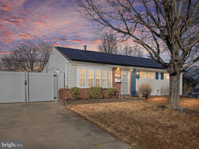 view of front of home with solar panels