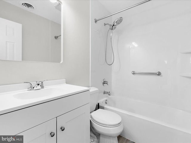 full bathroom featuring vanity, shower / washtub combination, and toilet