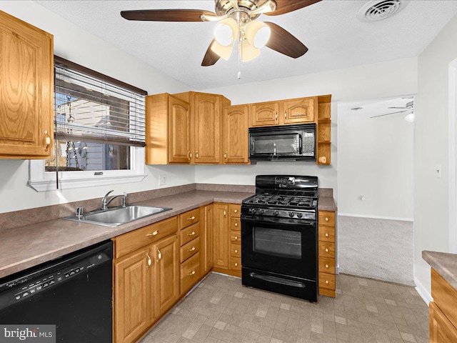 kitchen featuring sink, black appliances, a textured ceiling, and ceiling fan