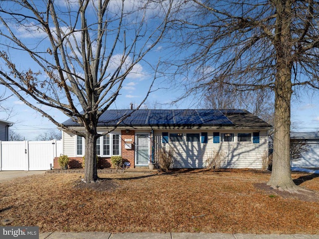 ranch-style house with solar panels