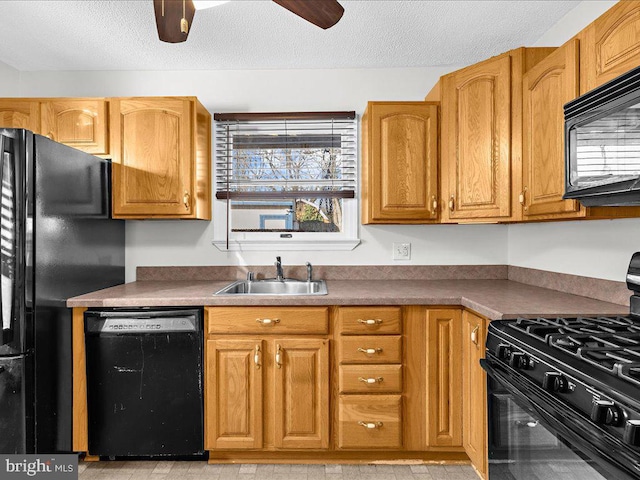 kitchen with sink, a textured ceiling, ceiling fan, and black appliances