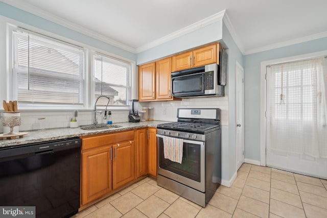 kitchen with sink, tasteful backsplash, ornamental molding, appliances with stainless steel finishes, and light stone countertops