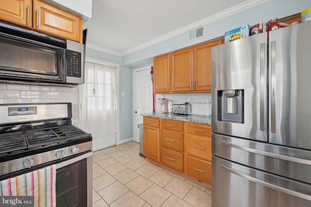 kitchen featuring light stone counters, tasteful backsplash, ornamental molding, and appliances with stainless steel finishes