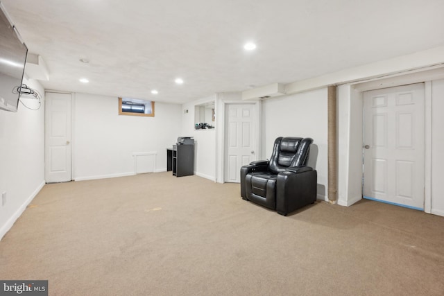 living area with light carpet