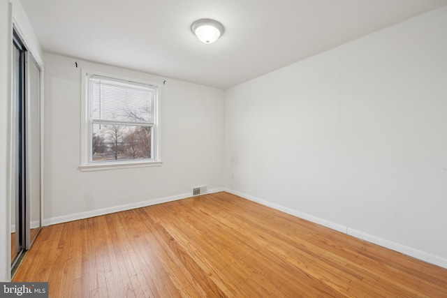 empty room featuring hardwood / wood-style floors