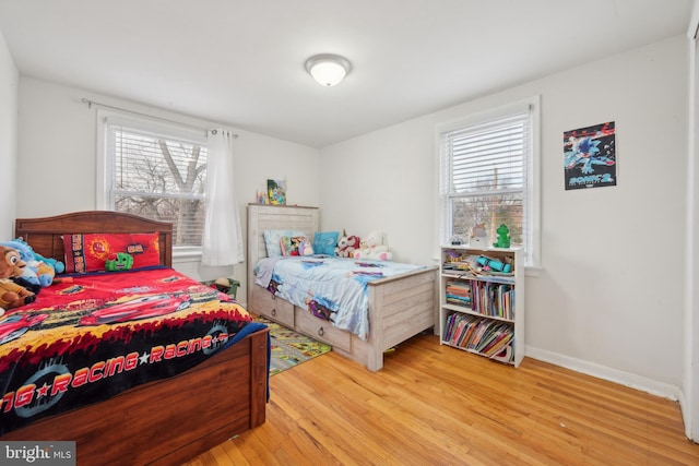 bedroom with light hardwood / wood-style floors