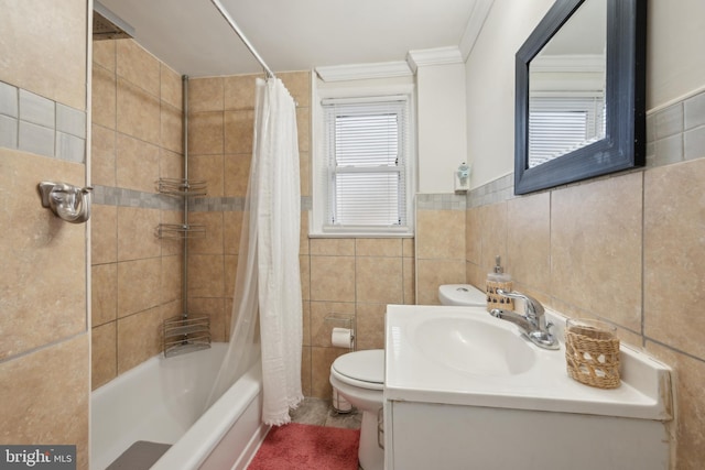 full bathroom with tile walls, vanity, shower / tub combo, toilet, and crown molding