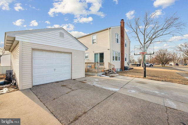 exterior space featuring an outbuilding and a garage