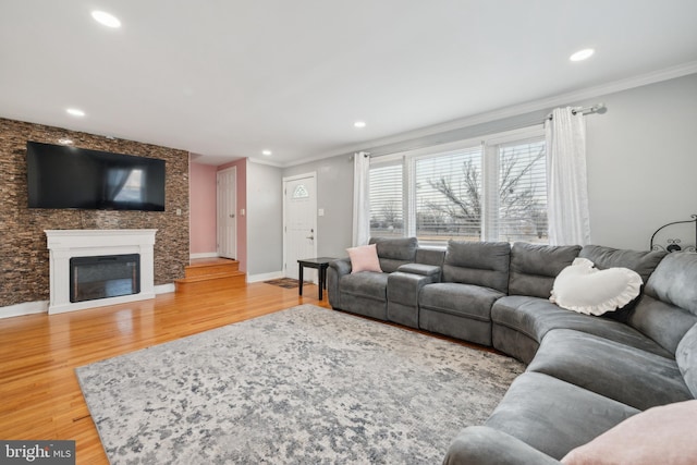 living room featuring ornamental molding and hardwood / wood-style floors