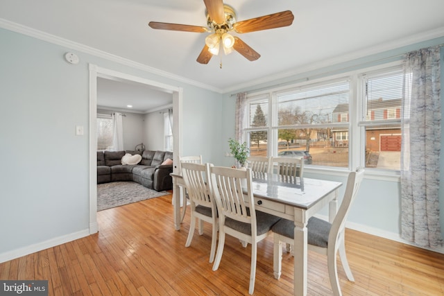 dining area featuring ornamental molding, plenty of natural light, ceiling fan, and light hardwood / wood-style floors