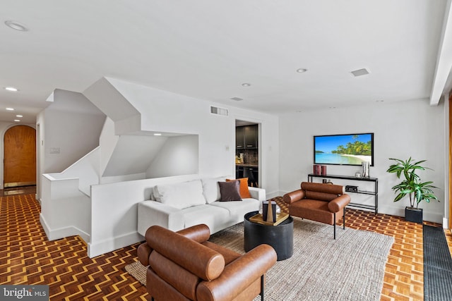 living room with dark parquet flooring