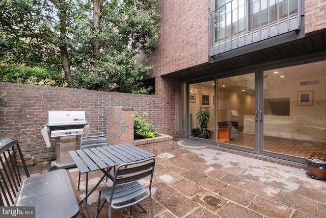 view of patio featuring a grill