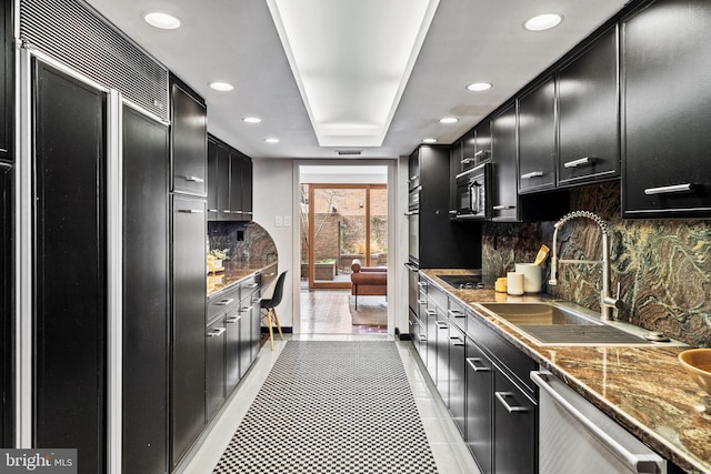 kitchen with light tile patterned flooring, sink, tasteful backsplash, stainless steel dishwasher, and paneled built in fridge