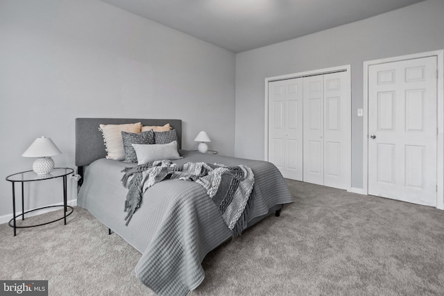 bedroom featuring light colored carpet and a closet