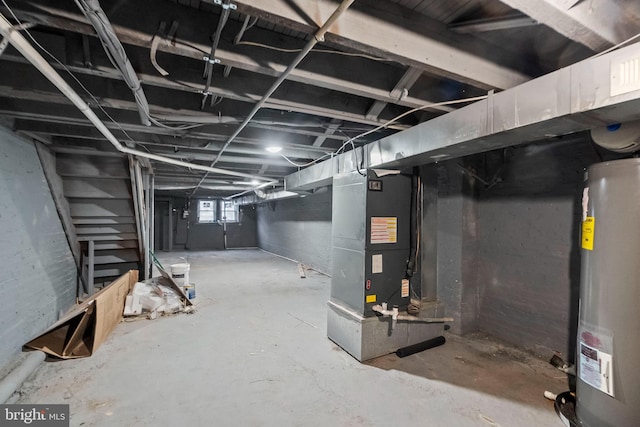 basement featuring water heater and heating unit