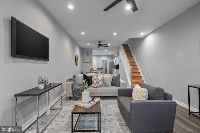 living room with ceiling fan and hardwood / wood-style floors