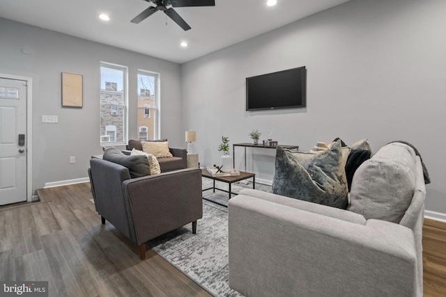 living room featuring hardwood / wood-style flooring and ceiling fan