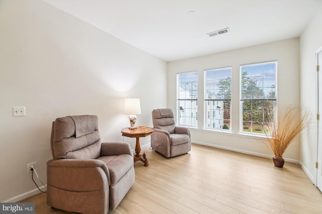 sitting room featuring light wood-type flooring