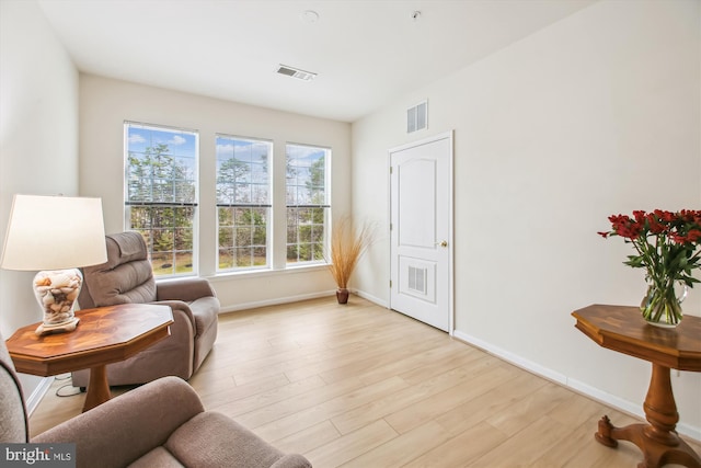 sitting room with light hardwood / wood-style flooring