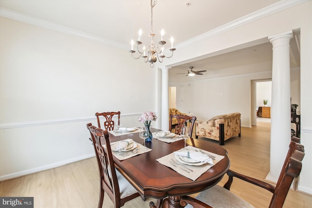 dining area with crown molding, decorative columns, and light wood-type flooring