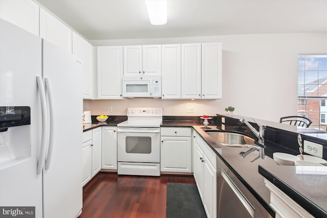 kitchen featuring sink, white appliances, dark hardwood / wood-style floors, and white cabinets