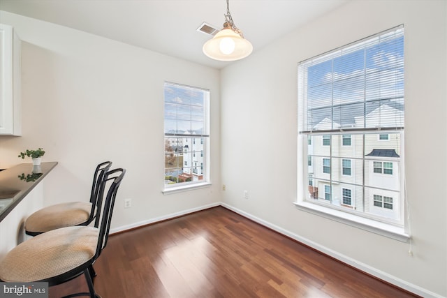 office with dark hardwood / wood-style floors