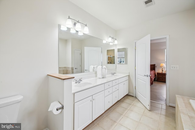 bathroom featuring tile patterned flooring and vanity