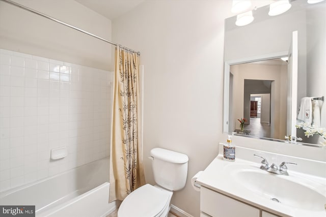 full bathroom with vanity, shower / tub combo, and toilet