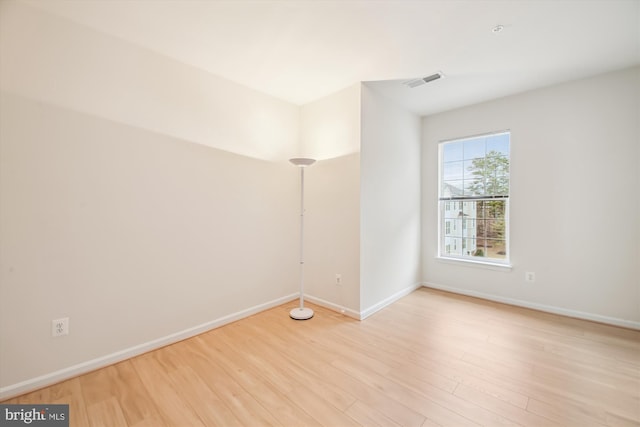 spare room with light hardwood / wood-style floors