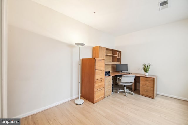 office space with light hardwood / wood-style flooring