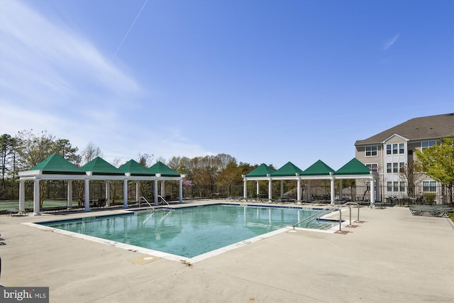 view of swimming pool featuring a gazebo and a patio area