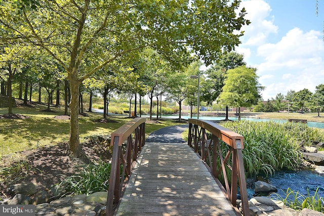 surrounding community featuring a water view