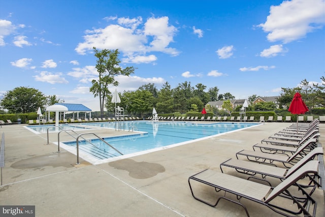 view of swimming pool with a patio