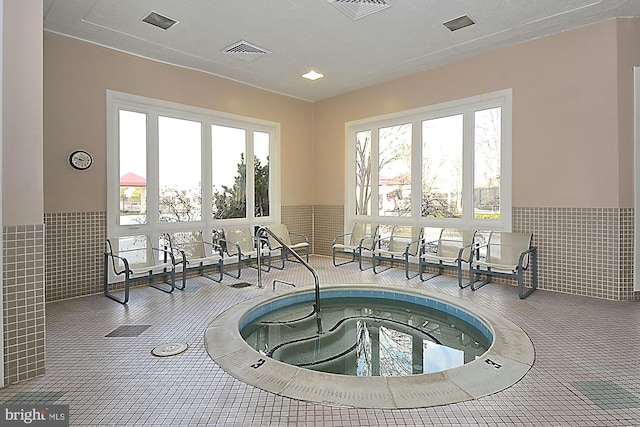 view of pool with an indoor in ground hot tub