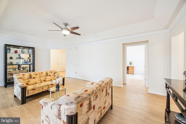 living room featuring ceiling fan and light wood-type flooring