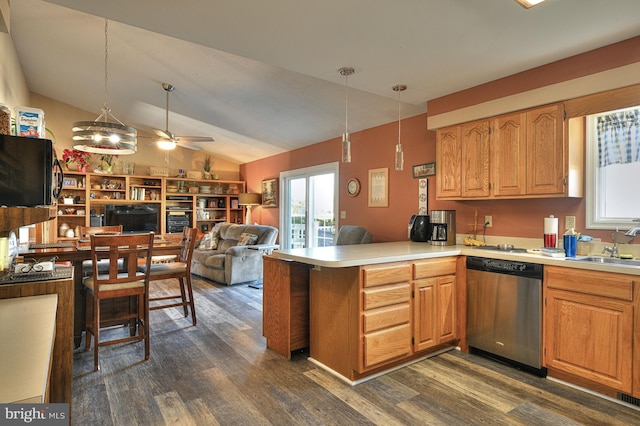 kitchen with dark hardwood / wood-style flooring, dishwasher, hanging light fixtures, and kitchen peninsula