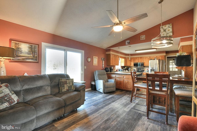 living room featuring dark hardwood / wood-style flooring, high vaulted ceiling, and ceiling fan