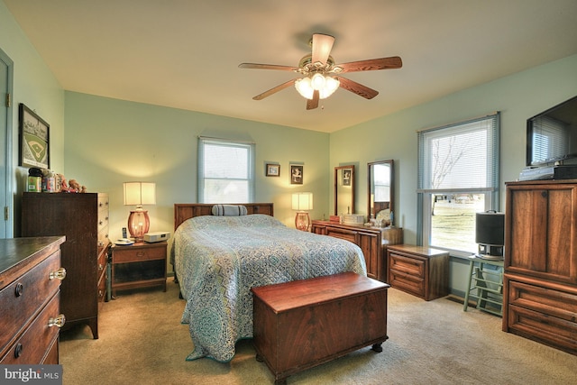 carpeted bedroom with ceiling fan