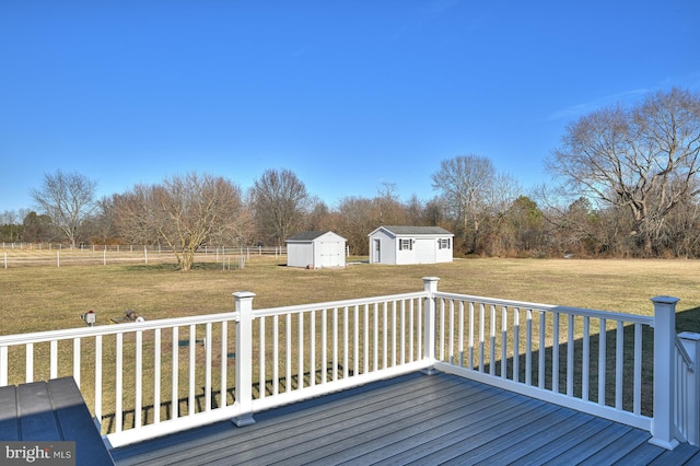 wooden deck with a lawn and a shed