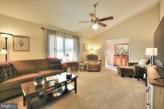 living room with ceiling fan, light colored carpet, lofted ceiling, and a textured ceiling