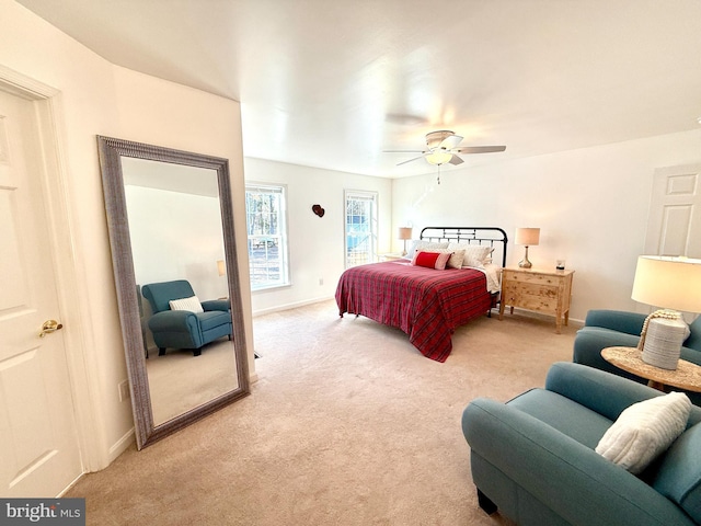 bedroom with light carpet and ceiling fan