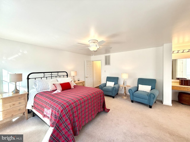 bedroom with light carpet and ceiling fan