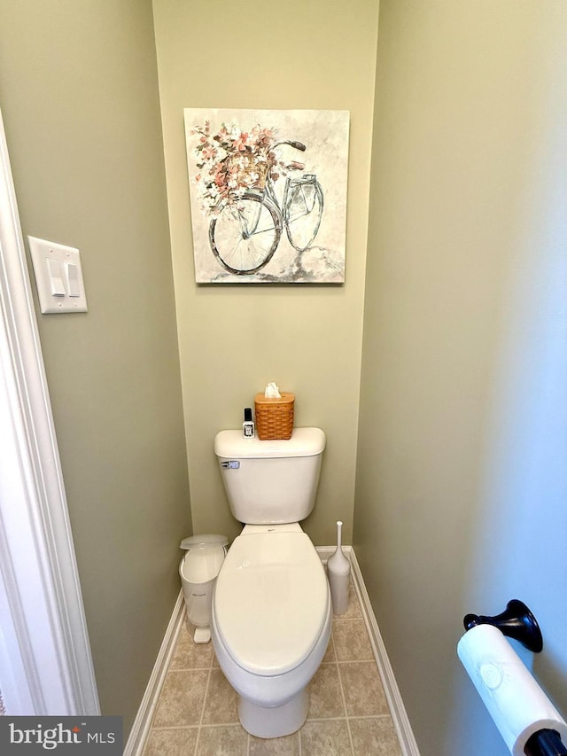 bathroom with tile patterned floors and toilet