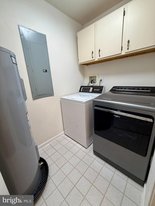 clothes washing area with cabinets, separate washer and dryer, and electric panel