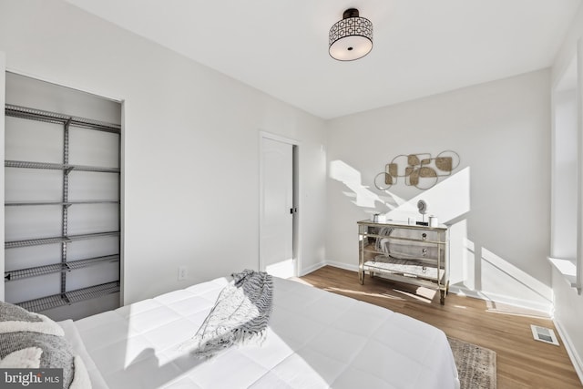 bedroom featuring wood-type flooring