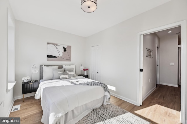 bedroom with light hardwood / wood-style floors