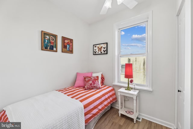 bedroom featuring ceiling fan and wood-type flooring