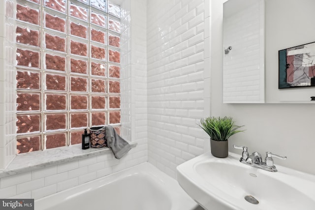 bathroom featuring sink and a bathtub