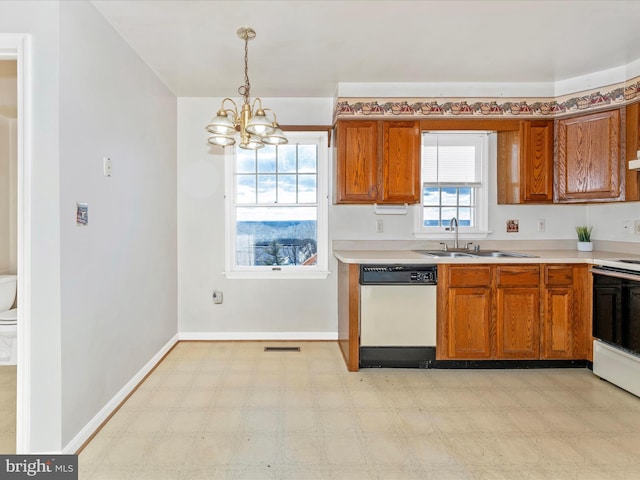 kitchen with white dishwasher, a sink, light countertops, electric stove, and light floors