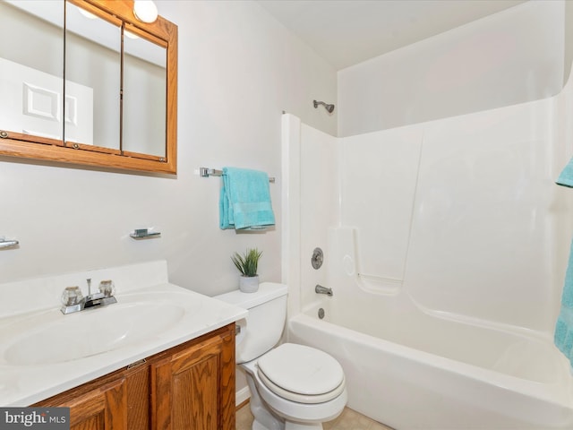 bathroom with toilet, shower / tub combination, and vanity